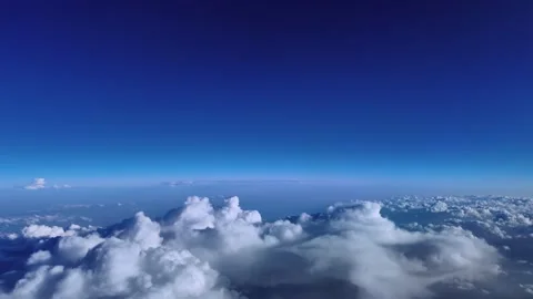 POV Flying at the Stratosphere Over Storm Clouds with a Curved Horizon Under a Stock Footage 345653889