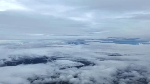 POV Flying Through Multilayered Ethereal Clouds in a Cold Winter Sky: A Pilot’s Stock Footage 325853531