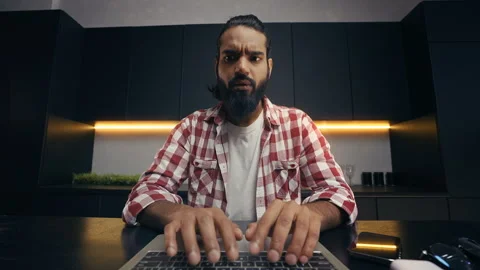 POV of focused Indian IT developer typing code on laptop, remote freelance work Stock Footage 313281410