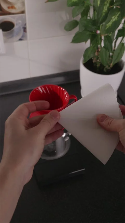 POV folding paper coffee filter for V60 manual brew Stock Footage 332720166