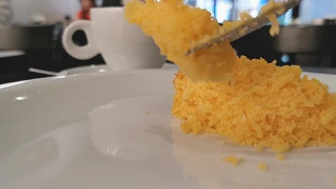 POV. Fork picks corn cake in close up. Selective focus, blurred background. Stock Footage 127165153