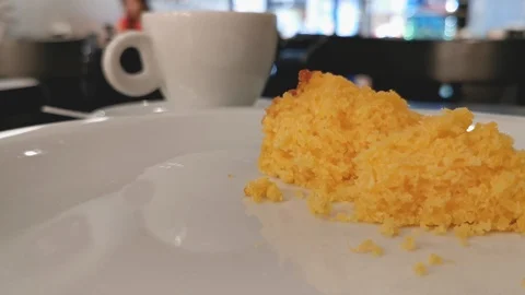 POV. Fork picks corn cake in close up. Selective focus, blurred background. Stock Footage 127166420