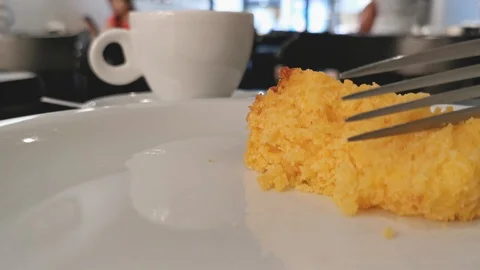 POV. Fork picks corn cake in close up. Selective focus, blurred background. Stock Footage 127204424