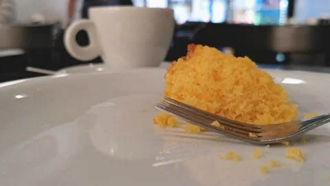 POV. Fork picks corn cake in close up. Selective focus, blurred background. Stock Footage 127208982