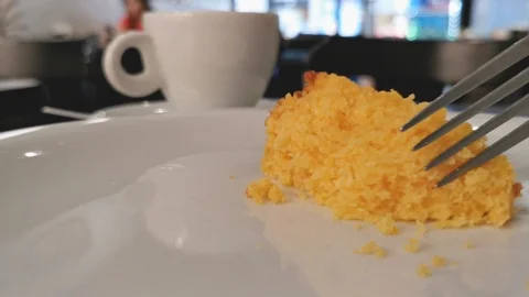 POV. Fork picks corn cake in close up. Selective focus, blurred background. Stock Footage 127229940