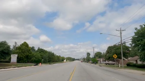 POV FPV driving cloudy sky urban scene people construction zone Tobacco Road Stock Footage 204947331