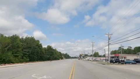 POV FPV driving cloudy sky urban scene people vintage retail storefronts and  Stock Footage 204947695