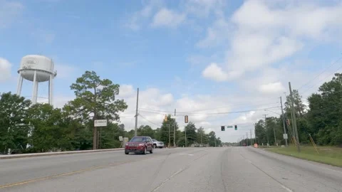 POV FPV driving cloudy sky urban scene apartments and residential homes on To Stock Footage 204947827