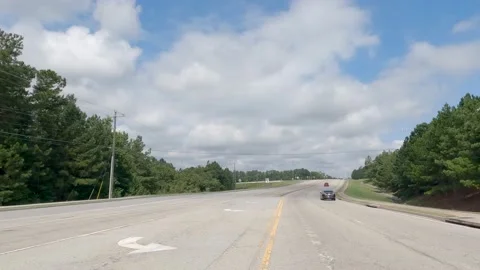 POV FPV driving cloudy sky Fort Gordon military base entrance on Tobacco Road Stock Footage 204948572