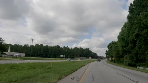 POV FPV driving cloudy sky construction zone signs rural highway Hwy 1 Stock Footage 204948759