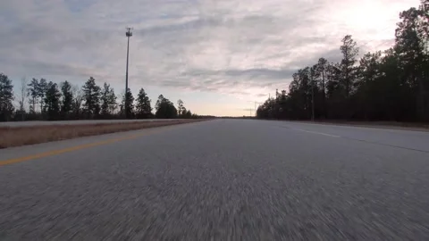 POV FPV driving down a rural country highway low to the ground view Stock Footage 152347384