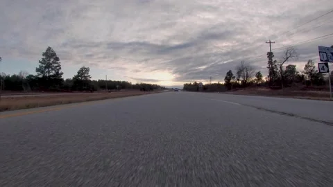 POV FPV driving down a rural country highway low to the ground view with traf Stock Footage 152379616