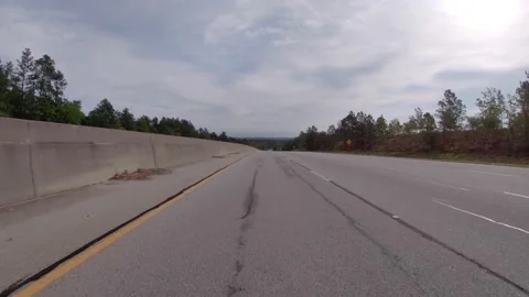 POV FPV driving over a hill for horizon reveal on a rural highway in the coun Stock Footage 153563053