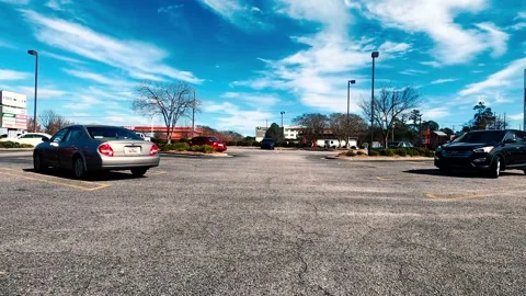 POV FPV driving through a parking lot full of cars Stock Footage 148127325