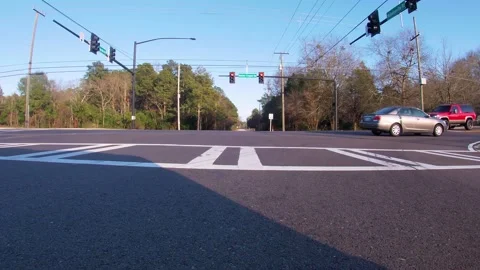 POV FPV driving traffic at a 4 way red light Barton Chapel road Stock Footage 152380338