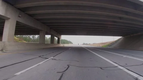 POV FPV driving under a bridge on a cloudy day Stock Footage 149382252