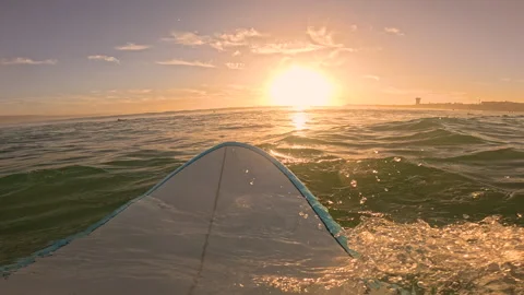 POV, FPV, LENS FLARE: View from surf lineup of rolling waves and setting sun Видео 314348185