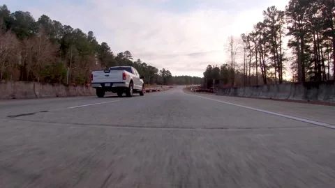 POV FPV low to the ground view exiting a highway construction zone on Highway Stock Footage 152347566