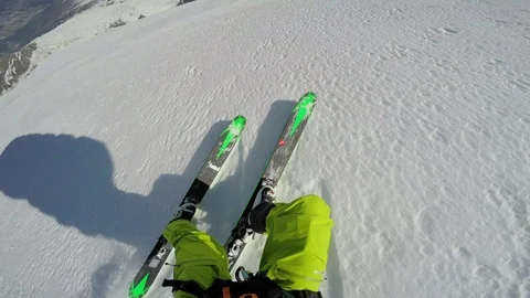 POV of freeride skier skiing down slope then jumping and parachuting, Aspen Video stock 129130032