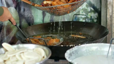 POV to fried taro from the deep fried pan 스톡 동영상 138163014