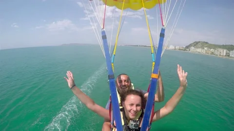 POV from front of ski of couple soaring through the air flying over sea, 4k u 動画素材 56028955