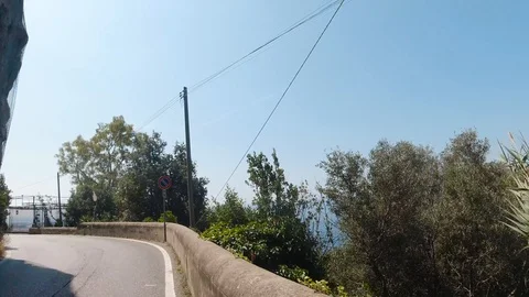 POV front view driving in mountainous curvy narrow road of Amalfi coast in Italy Stock Footage 114277526