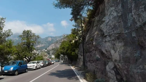 POV front view driving in mountainous curvy road Amalfi coast close to Positano Stock Footage 114279304