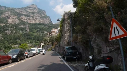 POV front view driving in mountainous curvy road Amalfi coast close to Positano Stock Footage 114280461