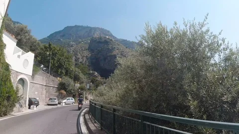 POV front view driving in mountainous curvy narrow road of Amalfi coast in Italy Stock Footage 114281241