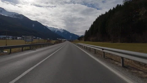 POV FRONT VIEW DRIVING PLATE car driving on winter roads in Austrian Alps Stock Footage 255202400
