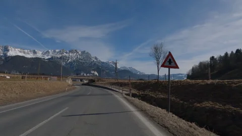 POV FRONT VIEW DRIVING PLATE car driving on winter roads in Austrian Alps Stock Footage 255202446
