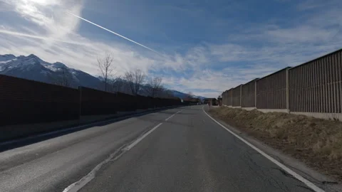 POV FRONT VIEW DRIVING PLATE car driving on winter roads in Austrian Alps Stock Footage 255202582