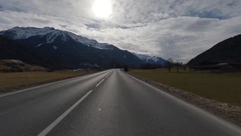 POV FRONT VIEW DRIVING PLATE car driving on winter roads in Austrian Alps Stock Footage 255202623