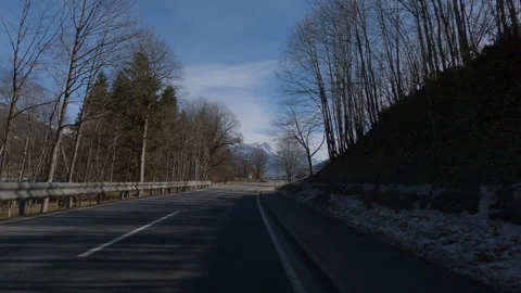 POV FRONT VIEW DRIVING PLATE car driving on winter roads in Austrian Alps Stock Footage 255202686