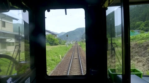 POV front view of train driving through rural countryside in Japan in summer Stock Footage 342287439
