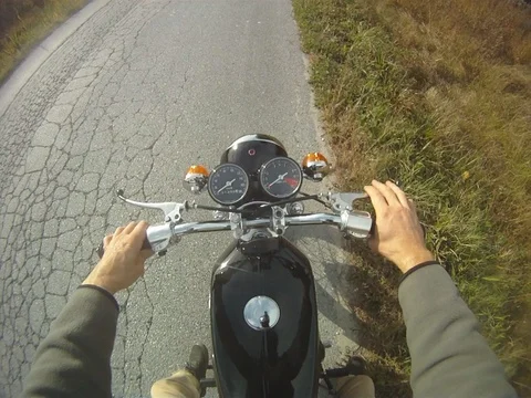 POV getting on 1968 Honda CB350 motorcycle. Eastern Townships, Quebec. Stock Footage