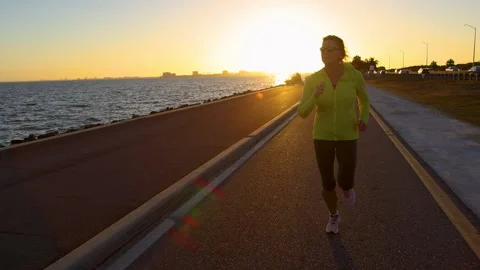 POV girl running at sunrise a healthy Stock Video Pond5