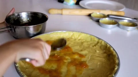 POV of girl's hands while preparing a homemade jam tart Stock Footage 221400221