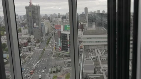 POV up a glass elevator overlooking city dreary day Stock Footage 232641092
