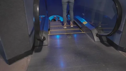 Pov going down escalator Stock Footage 315140676