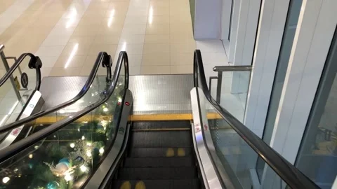 POV going down an escalator stairs inside a mall. Malling. Mall rats. Stock Footage 206752651
