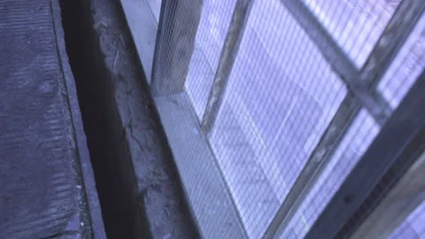 POV Going Up Freight Elevator - Looking Out Grimy Window Down at Street Stock Footage 148122168