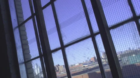 POV Going Up Industrial Elevator - Looking Out Grimy Window at Cityscape Stock Footage 148122163