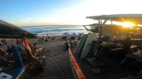 POV going with a surfboard on the beach during sunset Canggu Stock Footage 197932681