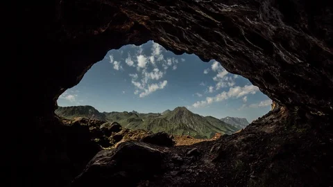 POV great mountains and clouds Seen From A Cave Stock-Footage 89755445