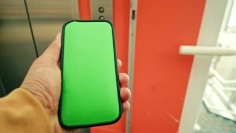 POV Green Screen Smartphone Held Near Subway Elevator Entrance Stock Footage 311030718