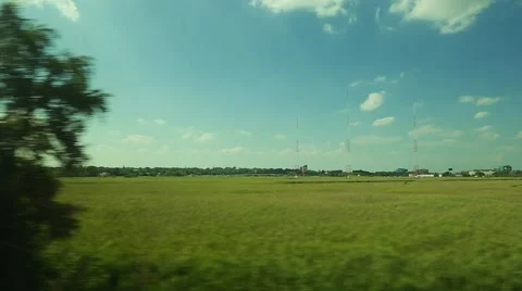 POV of greenery and landscape from inside of moving train Stock Footage 67381437