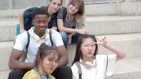 POV of a group of smiling multi-ethnic teenage students taking a selfie. Stock Footage 161398976