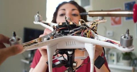 POV Hands Building A Robot Drone Being Held By A Young Woman Engineer Stock Footage 84290995
