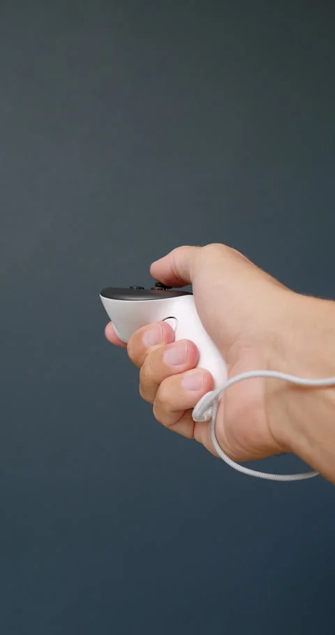 POV of hands holding white controller playing game. Stock Footage 259095087